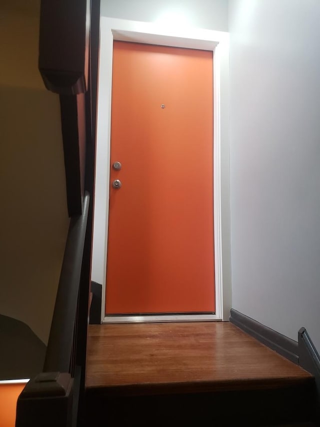 doorway to outside with wood finished floors