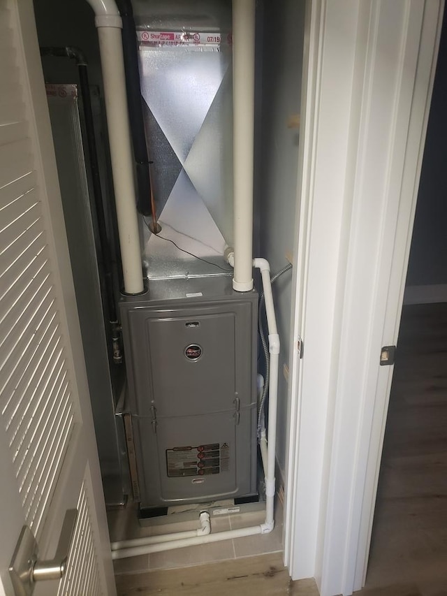 utility room with heating unit