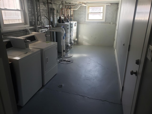 washroom with separate washer and dryer and gas water heater