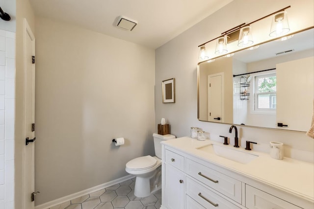 405 W Ivy Ln Unit 4A, Arlington Heights, IL 60004 - full bathroom featuring vanity, toilet, baseboards, tile patterned flooring, and a shower