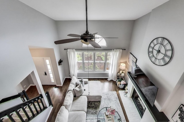 405 W Ivy Ln Unit 4A, Arlington Heights, IL 60004 - living area with wood finished floors, ceiling fan, high vaulted ceiling, and baseboards