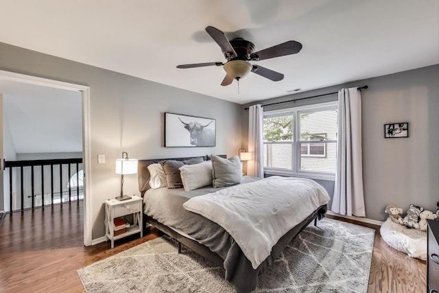 405 W Ivy Ln Unit 4A, Arlington Heights, IL 60004 - bedroom featuring wood finished floors, baseboards, and a ceiling fan