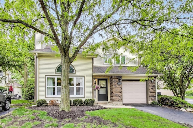 405 W Ivy Ln Unit 4A, Arlington Heights, IL 60004 - traditional-style home with driveway, brick siding, and an attached garage