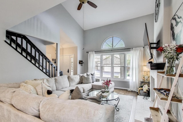 405 W Ivy Ln Unit 4A, Arlington Heights, IL 60004 - living room featuring high vaulted ceiling, stairs, wood finished floors, and a ceiling fan