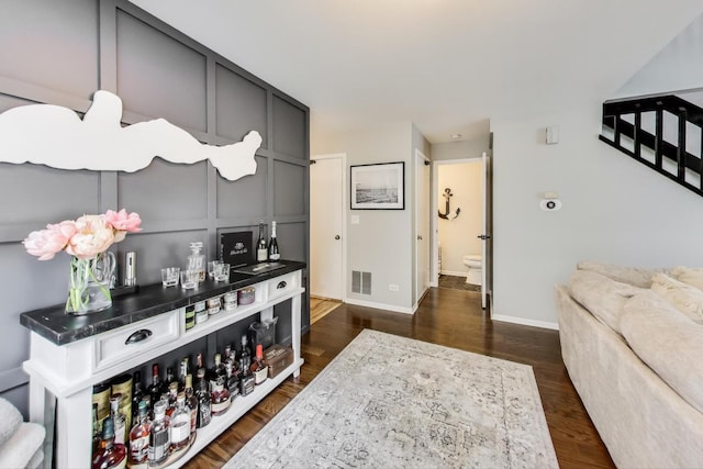 405 W Ivy Ln Unit 4A, Arlington Heights, IL 60004 - bar featuring baseboards, dark wood finished floors, and stairs