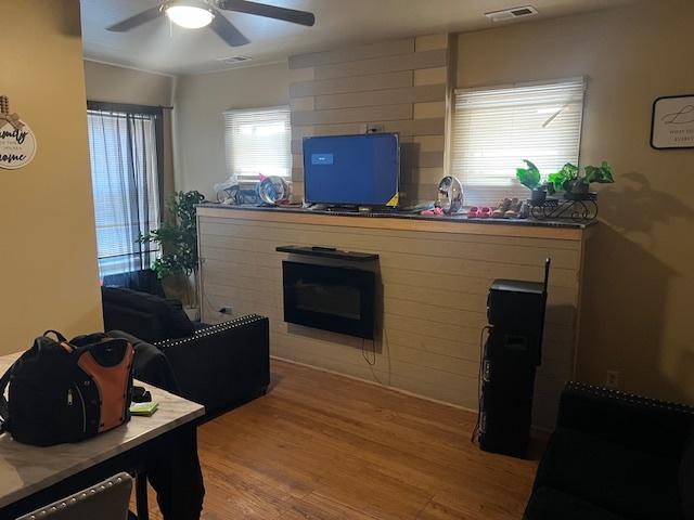1428 S St Louis Ave, Chicago, IL 60623 - living room featuring a ceiling fan and light wood finished floors