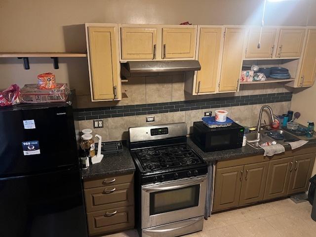 1428 S St Louis Ave, Chicago, IL 60623 - kitchen with black appliances, under cabinet range hood, open shelves, a sink, and dark countertops