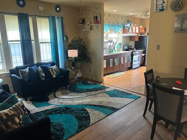 1428 S St Louis Ave, Chicago, IL 60623 - living area with wood finished floors and ceiling fan