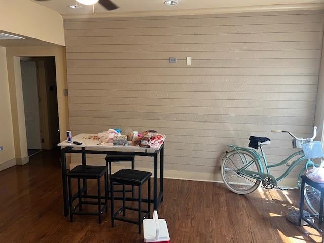 1428 S St Louis Ave, Chicago, IL 60623 - dining room with baseboards, dark wood-style flooring, ceiling fan, and wooden walls