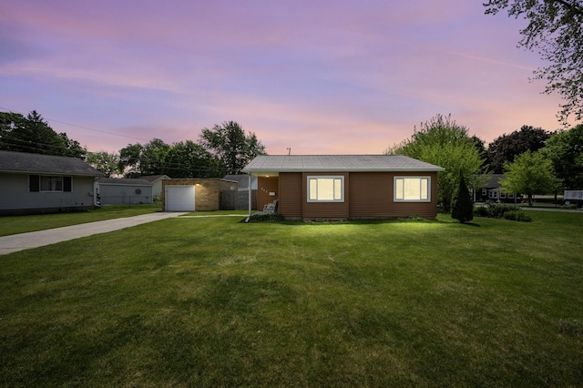 942 Dekalb Ave, Sycamore, IL 60178 - ranch-style home with concrete driveway, a lawn, a detached garage, and an outdoor structure
