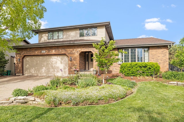 403 Tonelli Trl, Lockport, IL 60441 - view of front of property featuring brick siding, driveway, a front lawn, and a garage