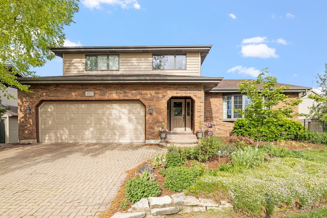 403 Tonelli Trl, Lockport, IL 60441 - view of front facade with brick siding, decorative driveway, and a garage