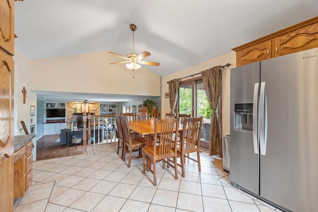 403 Tonelli Trl, Lockport, IL 60441 - dining area featuring a ceiling fan, light tile patterned flooring, a wood stove, high vaulted ceiling, and built in features