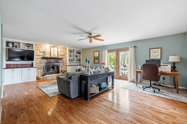 403 Tonelli Trl, Lockport, IL 60441 - living room featuring ceiling fan, wood-type flooring, a stone fireplace, an office area, and built in shelves