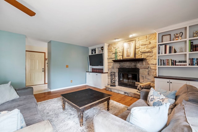 403 Tonelli Trl, Lockport, IL 60441 - living room featuring wood finished floors, a fireplace, and baseboards