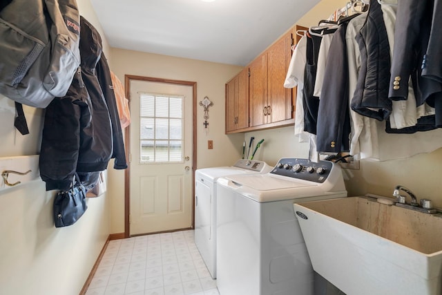 403 Tonelli Trl, Lockport, IL 60441 - laundry area featuring washer and clothes dryer, cabinet space, light floors, and baseboards