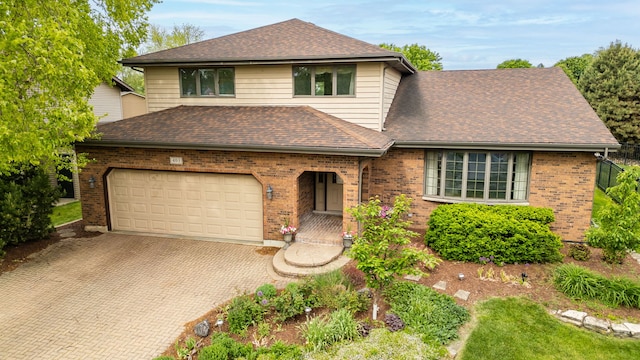 403 Tonelli Trl, Lockport, IL 60441 - view of front of home with brick siding, decorative driveway, and a shingled roof