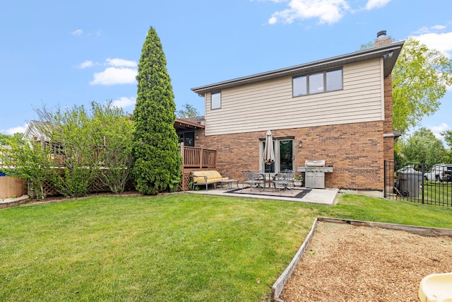403 Tonelli Trl, Lockport, IL 60441 - back of house featuring a chimney, brick siding, and a patio