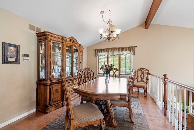 403 Tonelli Trl, Lockport, IL 60441 - dining area featuring a chandelier, light wood-style floors, and baseboards