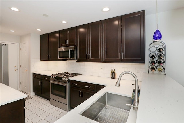 1608 W Ethans Glen Dr, Palatine, IL 60067 - kitchen with stainless steel appliances, a sink, backsplash, recessed lighting, and light countertops