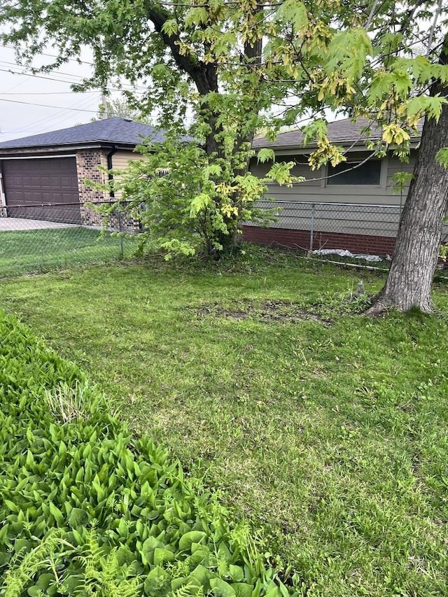 17814 Burnham Ave, Lansing, IL 60438 - view of yard with an attached garage and driveway