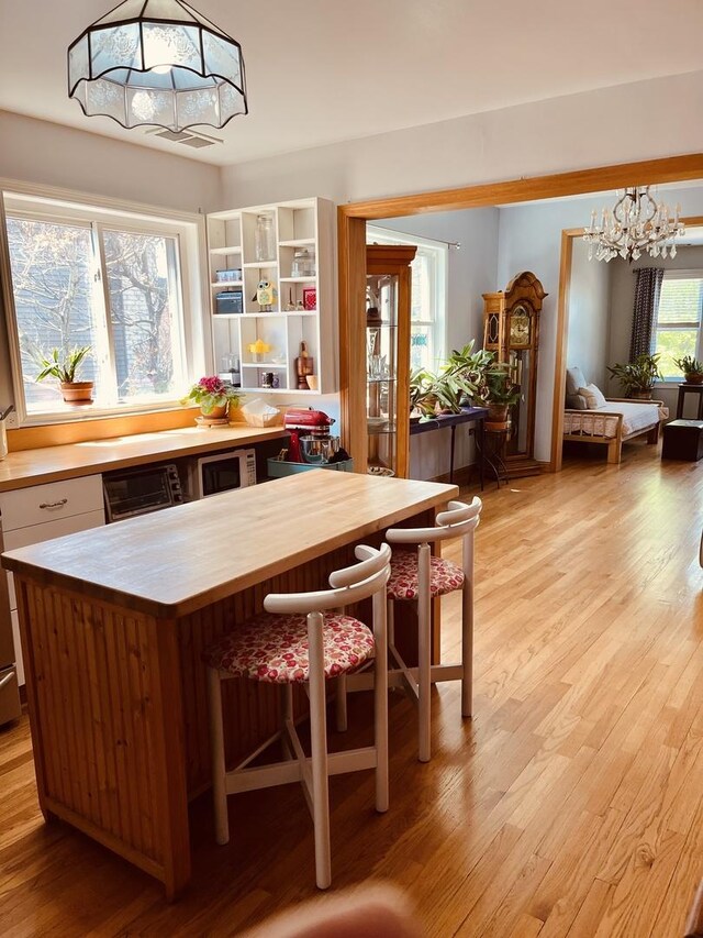 1723 N Richmond St, Chicago, IL 60647 - dining area with a chandelier and light wood-style floors