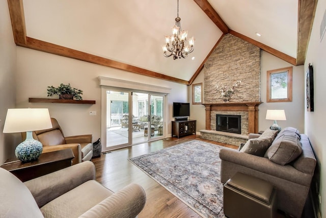 2041 Chatham Dr, Wheaton, IL 60189 - living room with beamed ceiling, wood finished floors, a chandelier, a stone fireplace, and high vaulted ceiling