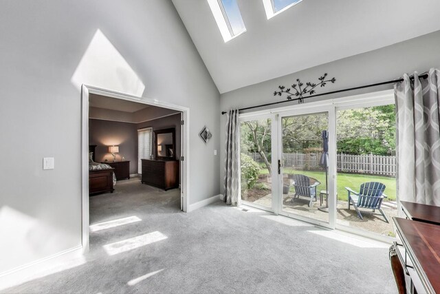 2041 Chatham Dr, Wheaton, IL 60189 - carpeted living area with high vaulted ceiling, a skylight, and baseboards
