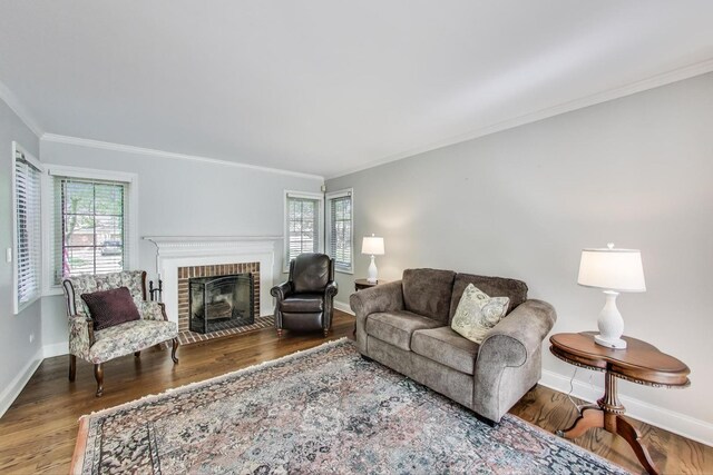 2041 Chatham Dr, Wheaton, IL 60189 - living room featuring ornamental molding, wood finished floors, a brick fireplace, and baseboards