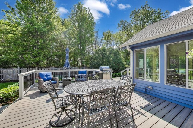 2041 Chatham Dr, Wheaton, IL 60189 - wooden terrace featuring outdoor dining area, fence, and view of wooded area