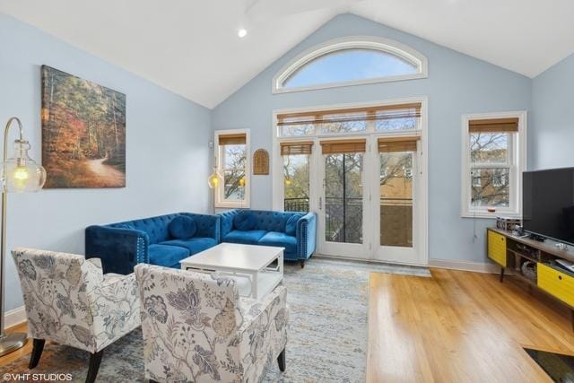 3934 W Argyle St Unit 3, Chicago, IL 60625 - living area featuring wood finished floors, vaulted ceiling, baseboards, and recessed lighting