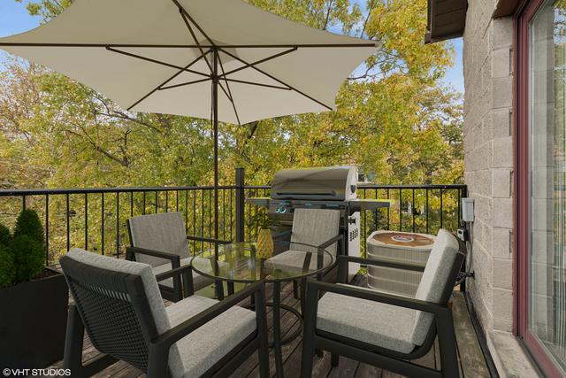 3934 W Argyle St Unit 3, Chicago, IL 60625 - wooden deck with grilling area