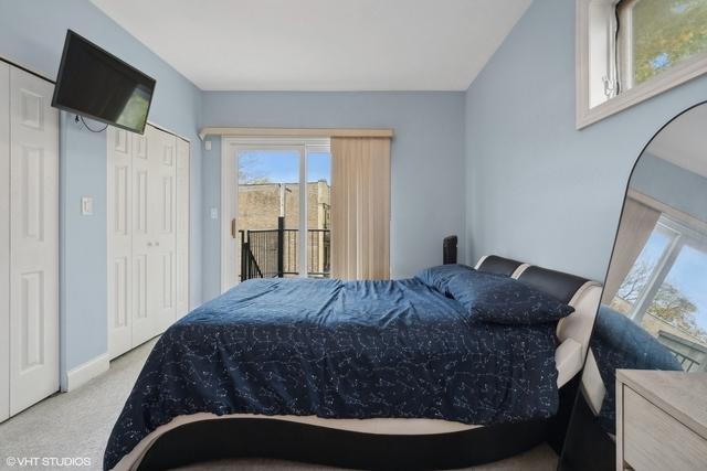3934 W Argyle St Unit 3, Chicago, IL 60625 - bedroom with access to exterior, carpet flooring, and baseboards