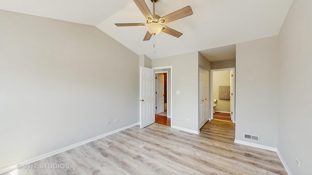 2135 Schumacher Dr, Naperville, IL 60540 - unfurnished bedroom featuring light wood-style floors, vaulted ceiling, baseboards, and a ceiling fan
