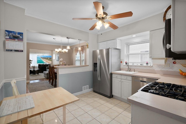kitchen featuring stainless steel fridge with ice dispenser, a sink, light countertops, a chandelier, and dishwasher