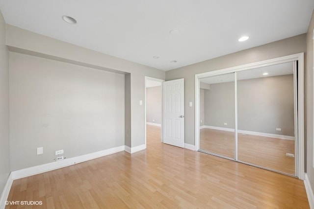 36 Chestnut Rd, Northbrook, IL 60062 - unfurnished bedroom featuring light wood-style flooring, baseboards, a closet, and recessed lighting
