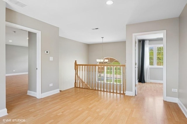 36 Chestnut Rd, Northbrook, IL 60062 - unfurnished room with a chandelier, light wood-style floors, baseboards, and recessed lighting