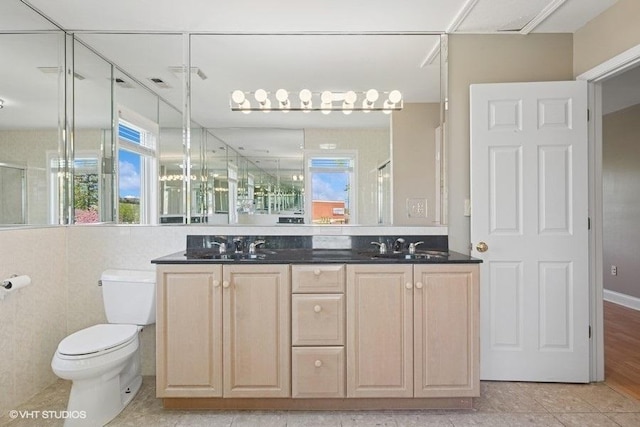 36 Chestnut Rd, Northbrook, IL 60062 - bathroom with toilet, a stall shower, double vanity, and tile patterned floors