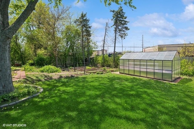 36 Chestnut Rd, Northbrook, IL 60062 - view of grassy yard with an exterior structure, a garden, and an outdoor structure