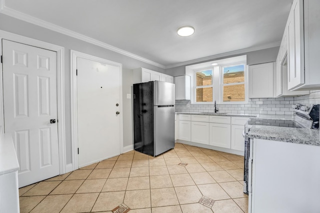 7133 W 16th St, Berwyn, IL 60402 - kitchen with appliances with stainless steel finishes, a sink, tasteful backsplash, white cabinetry, and crown molding