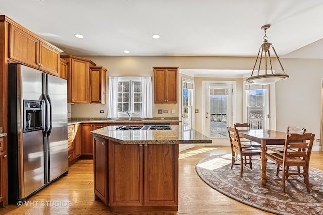 9310 Nicklaus Ln, Lakewood, IL 60014 - kitchen featuring stainless steel appliances, light wood-style flooring, stone counters, brown cabinets, and recessed lighting