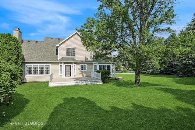 9310 Nicklaus Ln, Lakewood, IL 60014 - rear view of property with a lawn, a wooden deck, roof with shingles, and a chimney