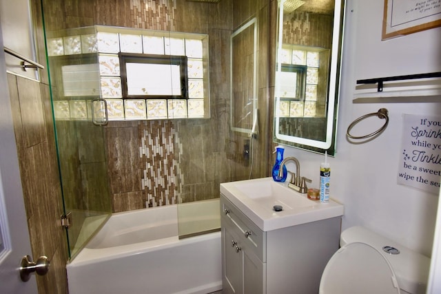 2837 18th St, North Chicago, IL 60064 - bathroom featuring healthy amount of natural light, vanity, toilet, and enclosed tub / shower combo
