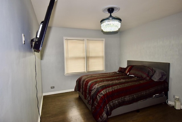 2837 18th St, North Chicago, IL 60064 - bedroom featuring wood finished floors, baseboards, and a chandelier