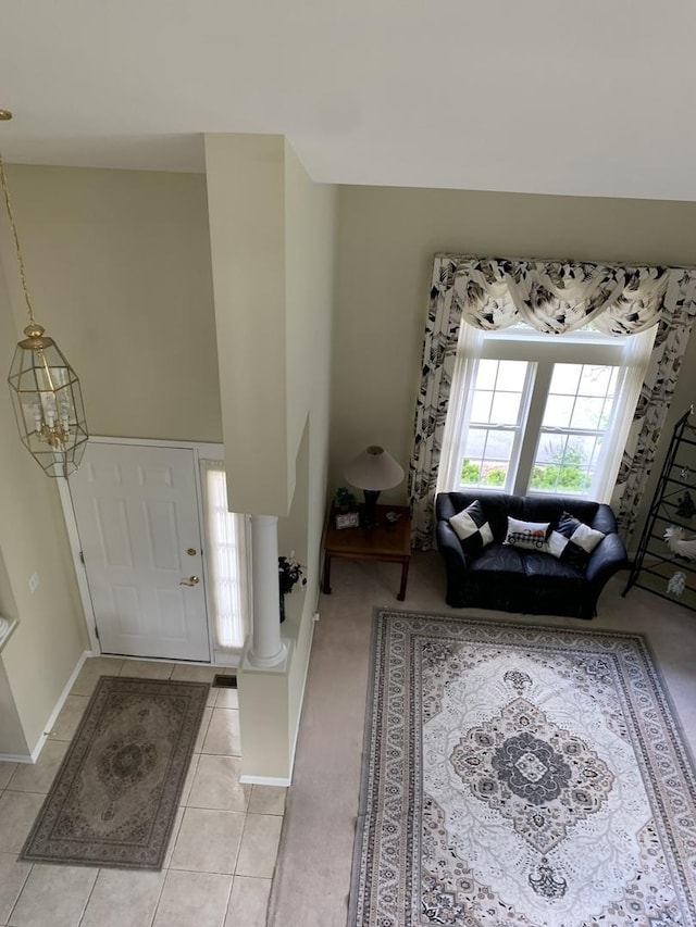 entryway featuring light tile patterned floors and baseboards