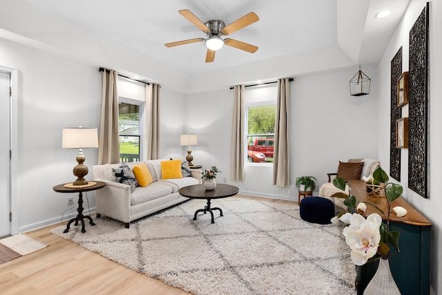 104 S Taylor St, Towanda, IL 61776 - living area with wood finished floors, a ceiling fan, and baseboards