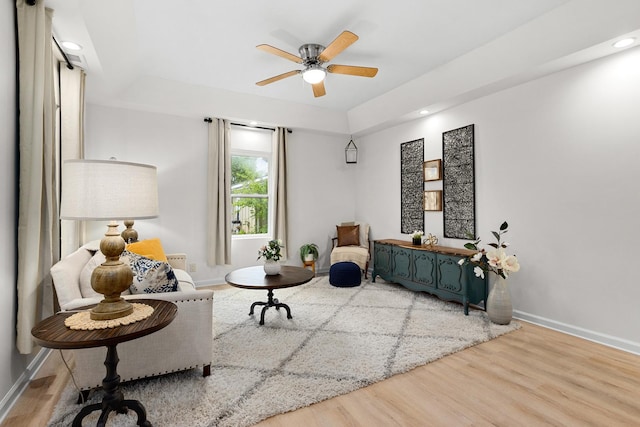 104 S Taylor St, Towanda, IL 61776 - sitting room featuring wood finished floors, baseboards, a tray ceiling, ceiling fan, and recessed lighting
