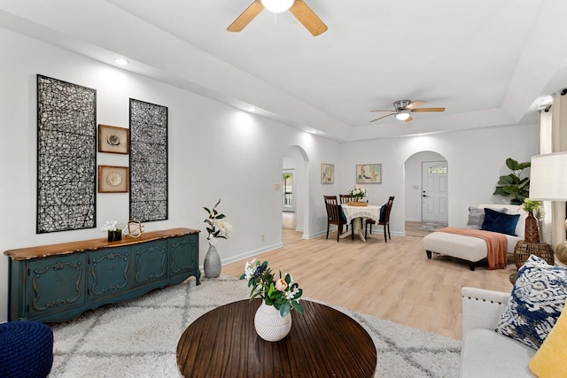 104 S Taylor St, Towanda, IL 61776 - living room featuring arched walkways, a ceiling fan, baseboards, and recessed lighting