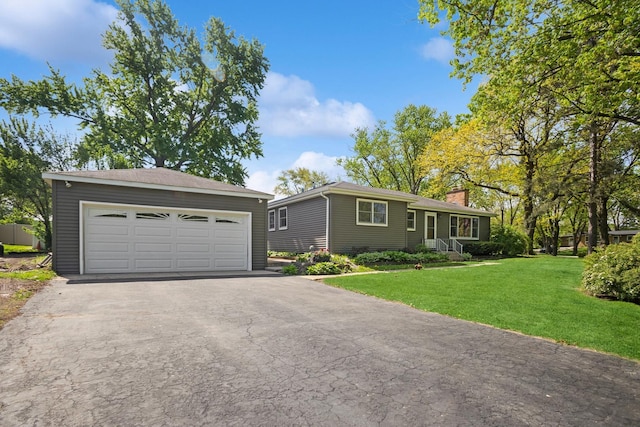 133 Maple Ct, Bloomingdale, IL 60108 - ranch-style home featuring a chimney, a front yard, an outdoor structure, and a detached garage