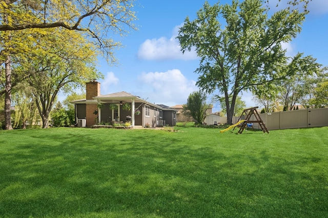 133 Maple Ct, Bloomingdale, IL 60108 - view of yard with a ceiling fan and a playground